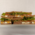 24 Sándwiches olímpicos en pan negro triples de copetín